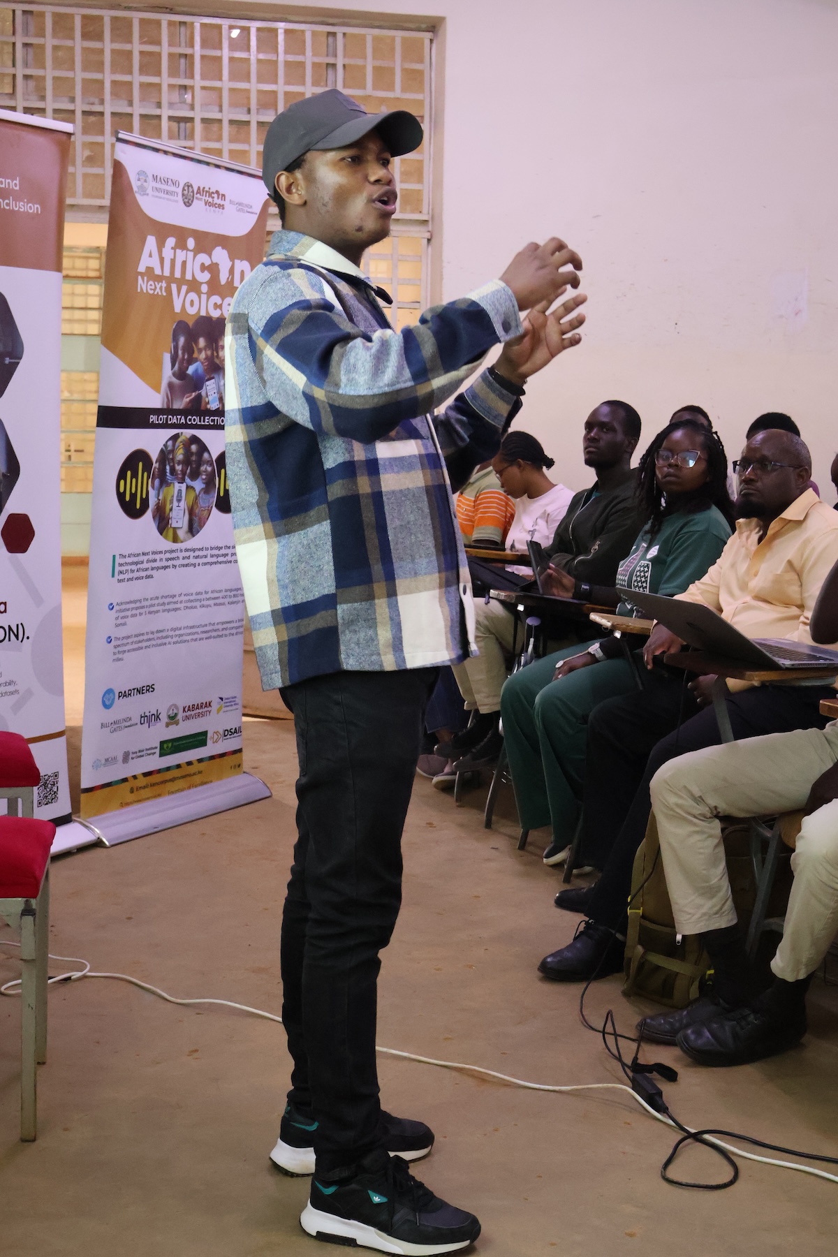 Thapelo Sindane speaking to an audience at MCAAI, Maseno University