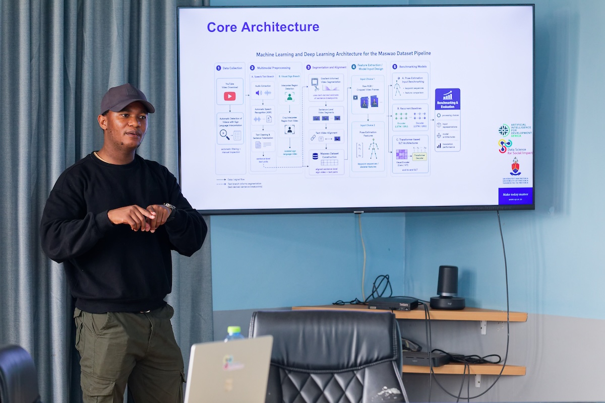 Thapelo Sindane presenting a slide on the machine learning architecture of his sign language dataset pipeline at RAIL, KNUST